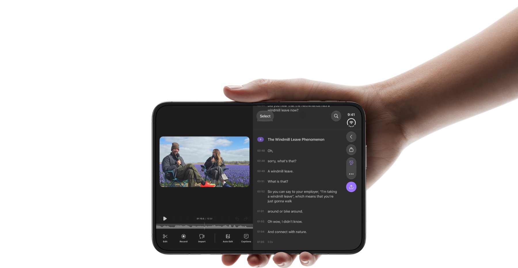 A person holding an open iPhone Duo while editing a video and its transcript